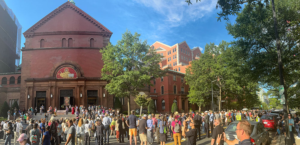 An estimated 1,000 Catholics and others supporting migrants gather outside the Cathedral of St. Matthew the Apostle in Washington after a procession to observe the World Day of Migrants and Refugees Sept. 28, 2025. (GSR photo/Rhina Guidos)