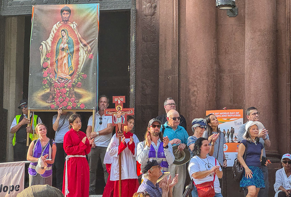Youth from the Shrine of the Sacred Heart gather at the entrance of the Cathedral of St. Matthew the Apostle in Washington after a procession to observe the World Day of Migrants and Refugees Sept. 28, 2025. (GSR photo/Rhina Guidos)