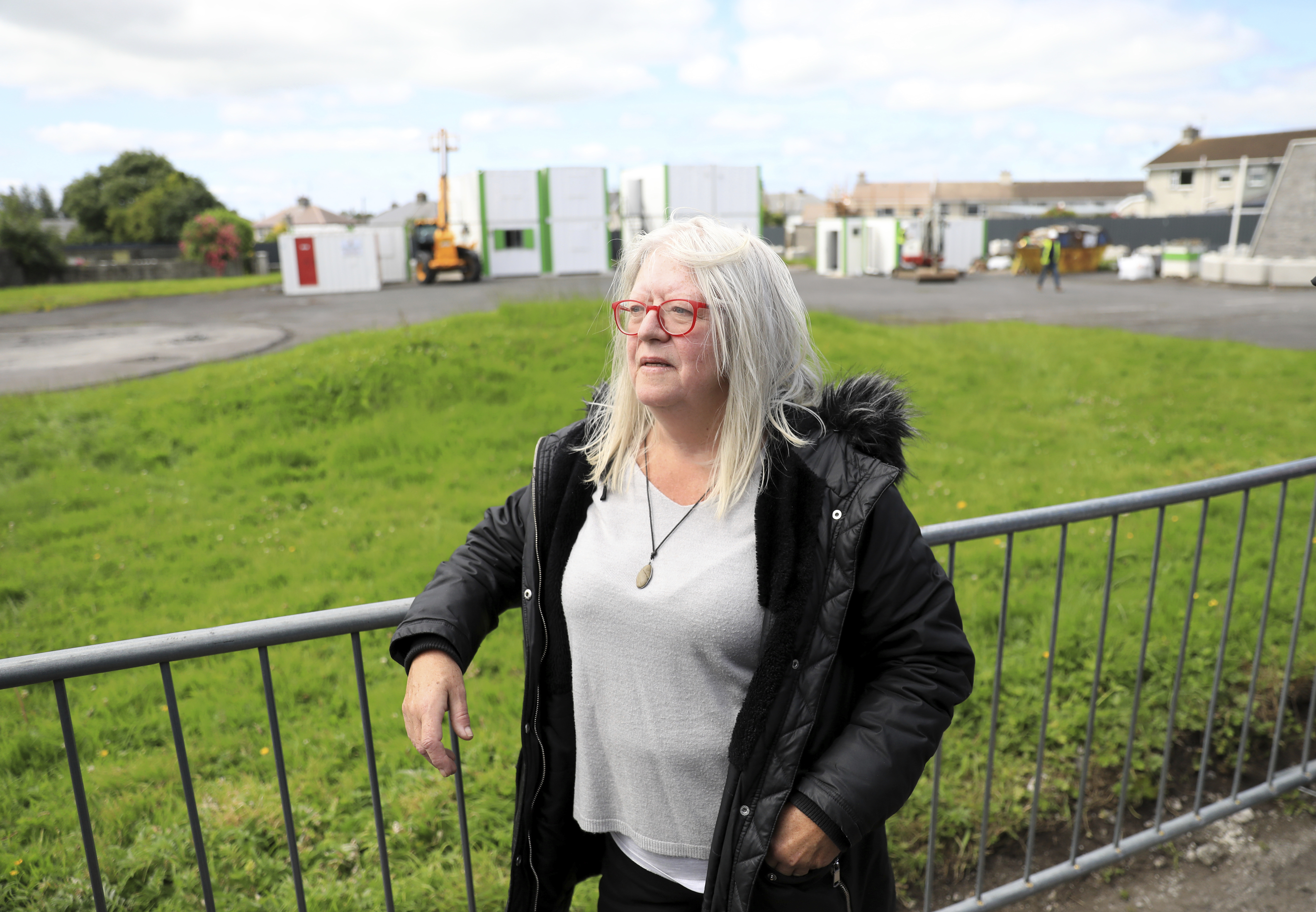 Anna Corrigan looks on at the excavation site of St Mary's home for unmarried mothers and their children, in Tuam, Ireland, July 7. A member of the Tuam Babies Family Group, Corrigan believes her two brothers, John and William Dolan, may be buried at the site.(AP/Peter Morrison)