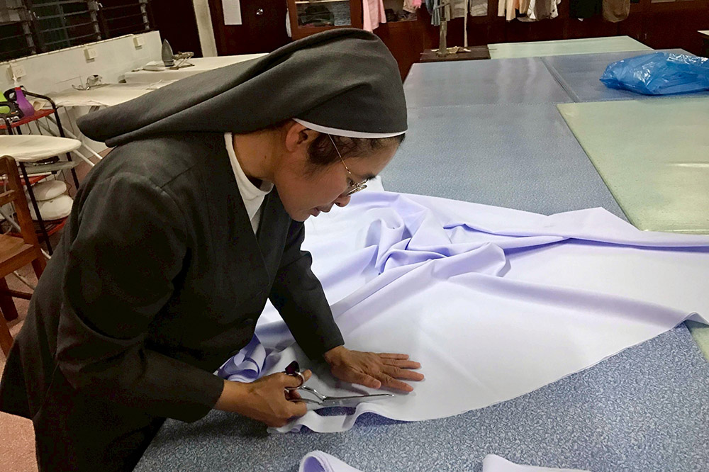 St. Paul de Chartres Sr. Marie-Agnes Suwanna Buasap teaches sewing to women and girls in Thailand. (Courtesy of Marie-Agnes Suwanna Buasap)