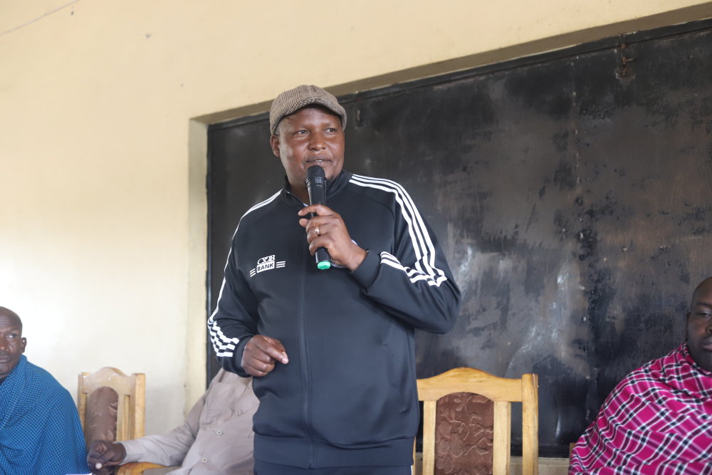 Emmanuel Lekishon Shangai, the legislator representing Ngorongoro, addresses Maasai residents raising concerns about government plans to remove them from ancestral land for tourism and wildlife protection. (GSR photo/Doreen Ajiambo)