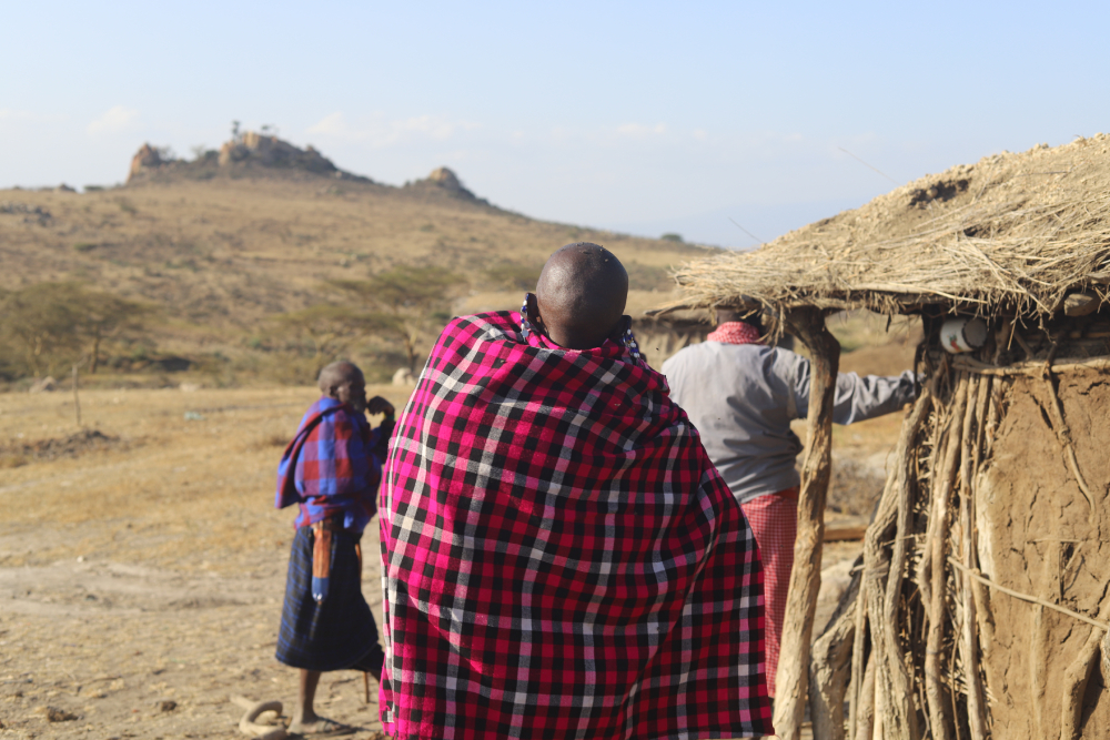 A Maasai woman carries her baby outside her hut in the Ngorongoro Conservation Area. Evictions have hit women and children especially hard, disrupting education, health care and family livelihoods. (GSR photo/Doreen Ajiambo)