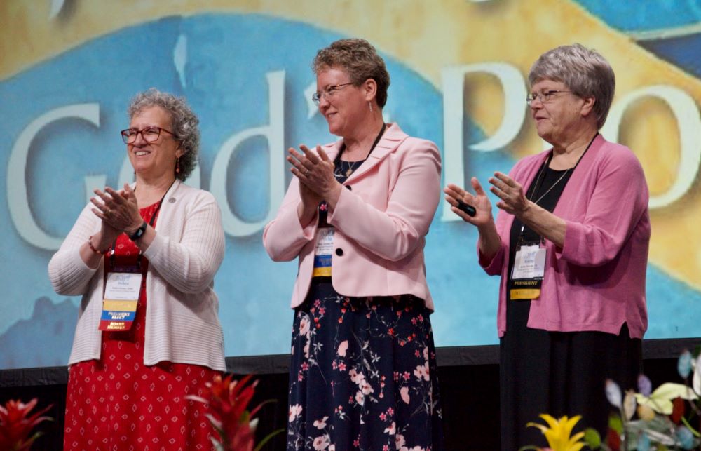 LCWR president-elect Sr. Debra Sciano, left, stands on the LCWR assembly stage with president Sr. Vicky Larson and past president Sr. Kathy Brazda in Atlanta Aug. 15. (GSR photo/Dan Stockman)