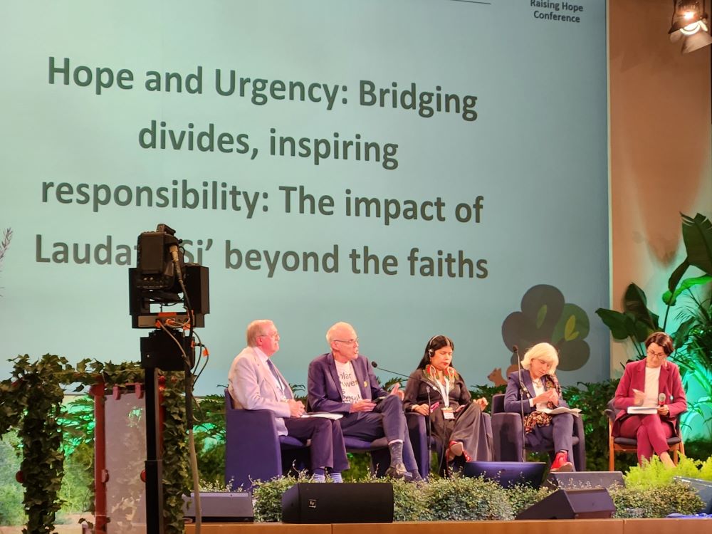 Speakers including climate activist and writer Bill McKibben at a panel discussion.