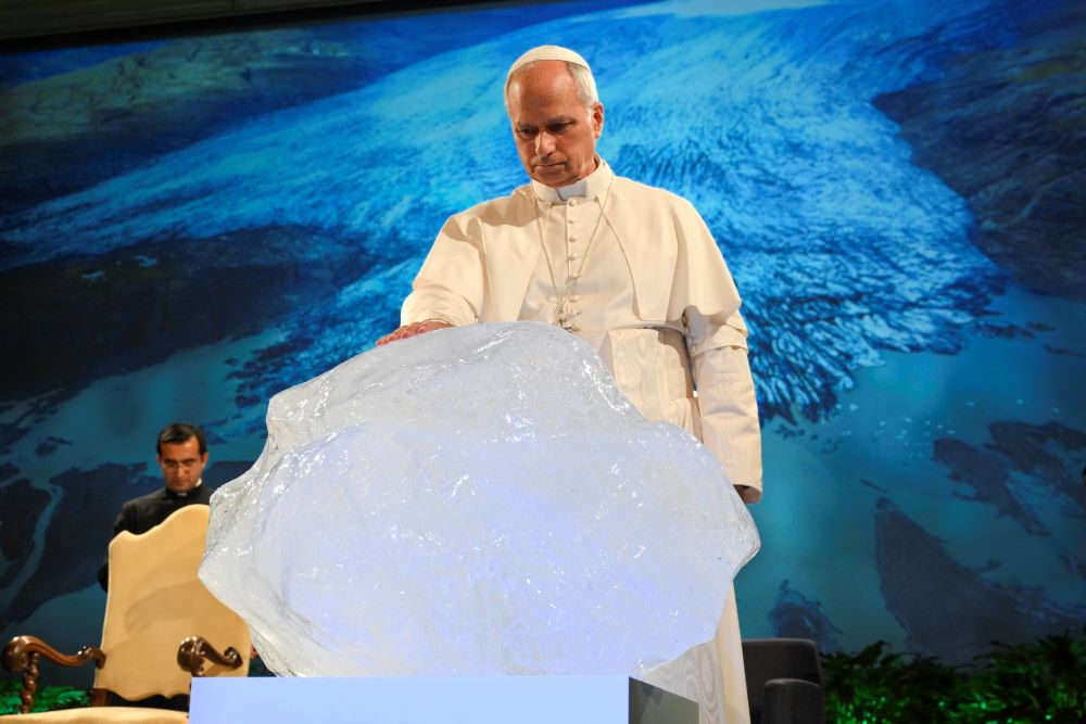 Pope Leo XIV blesses a chunk of ice from a glacier in Greenland.