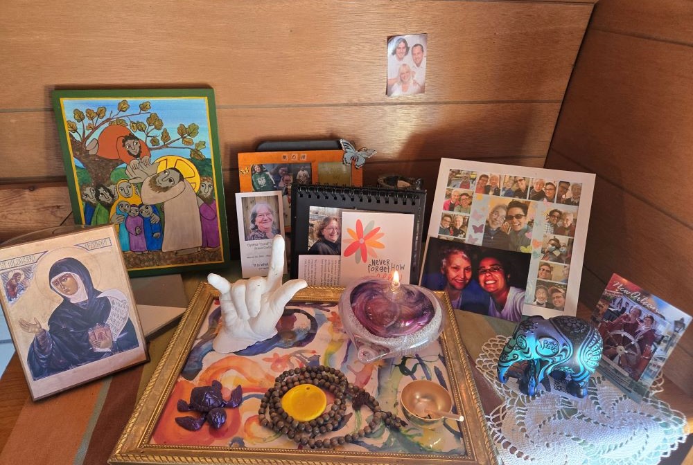 A table with pictures and candle