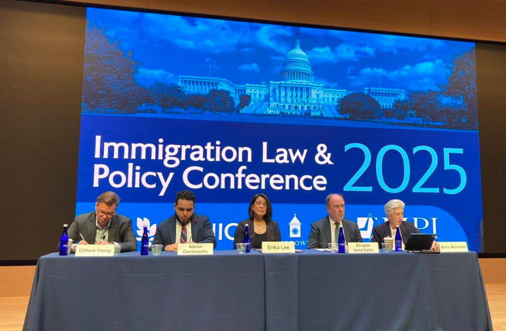 Five panelists take part in the Immigration Law and Policy Conference at Georgetown University in Washington Oct 9, 2025.