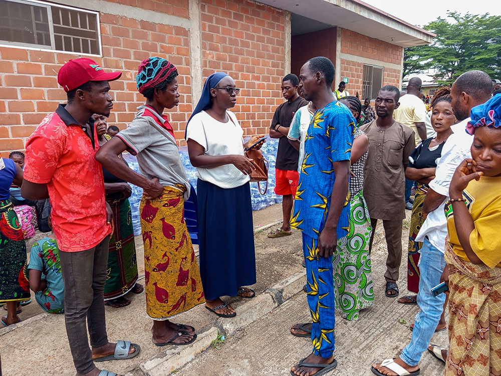 Sr. Mary Ojonugwa Unwuchola interacts with survivors at the International Market Camp for internally displaced people in Makurdi, Benue State, Nigeria. Unwuchola listens to survivors' concerns, prays with them, offers encouragement, and spends time with them, giving them hope for a better tomorrow. (John Chukwu)