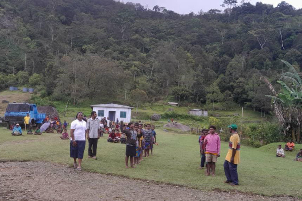 Sr. Shiny, a nurse, visits patients at one of the Cluny sisters' health clinics in Papua New Guinea. Electricity and water access are not always available, and the mountainous environment makes it difficult for people far from the clinic to access services. (Courtesy of Sylvian Aua)