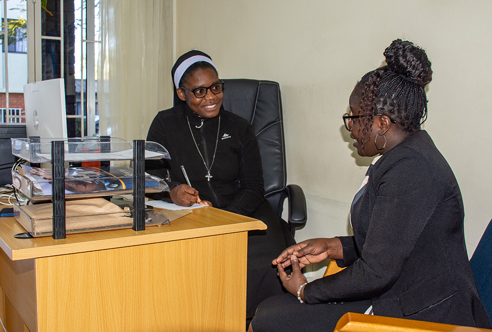 Dominican Sr. Christine Tembo speaks to one of her clients ahead of a SMART Couple Methodology counseling session. (GSR photo/Derrick Silimina)