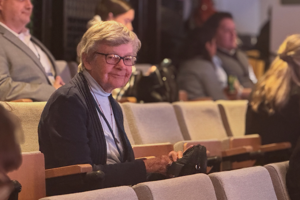 Franciscan Sr. Marie Lucey waits for the afternoon session of the 22nd Annual Immigration Law and Policy Conference Oct. 9, 2025 at Georgetown University Law Center in Washington.