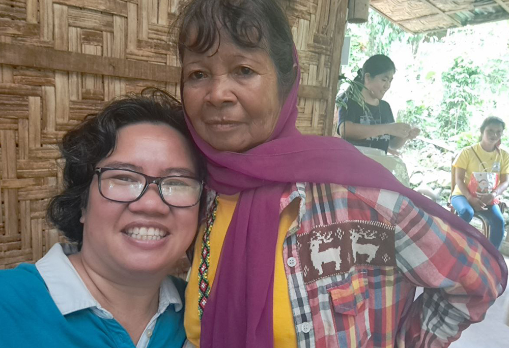 Petite Lao, left, and longtime friend Samidan, a Menubu Dulangan elder and knowledge keeper, are pictured in December 2024 in Kulamana — a remote Indigenous municipality in Mindanao, now known as Senator Ninoy Aquino in the Philippines. Lao consults her friend for education about Menubu Dulangan culture, especially their dances and stories. (Courtesy of Patricia Lourdes (Petite) Navarra Lao)