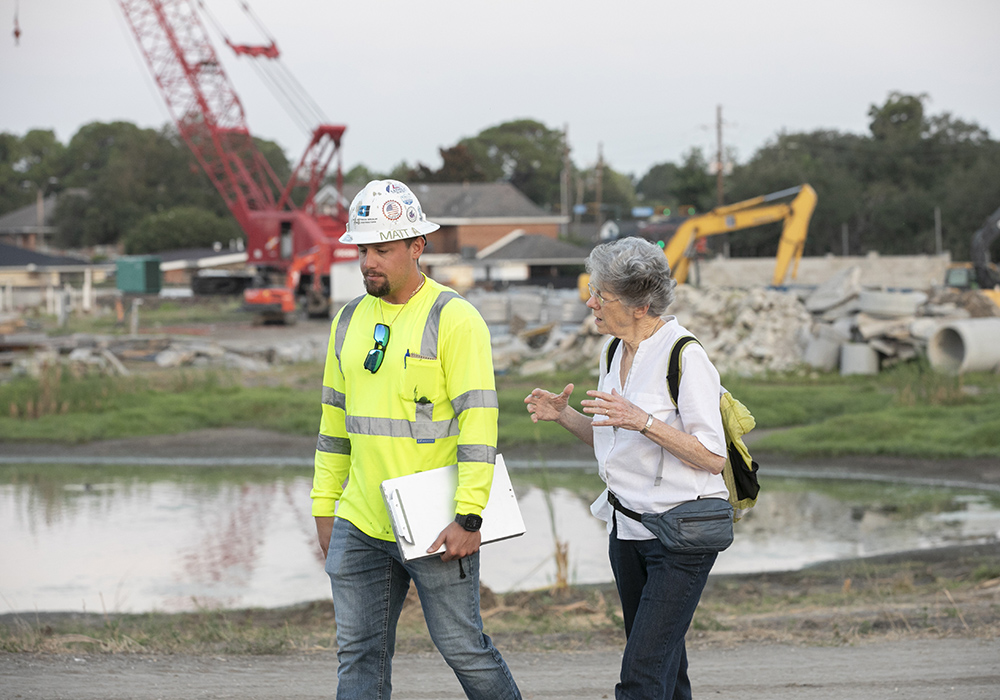 Sr. Joan Laplace speaks with a construction worker in September 2025. The Congregation of the Sisters of St. Joseph's Mirabeau Water Garden in New Orleans is under construction, and a completion date for Phase 1 is in sight. (Courtesy of the Congregation of Sisters of St. Joseph)