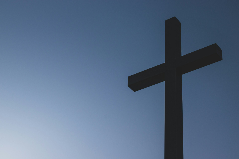 A plain backlit cross