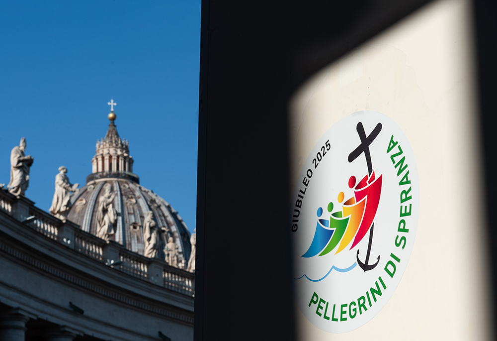 A combination photo shows St. Peter’s Basilica and the logo chosen by the Vatican for the Holy Year 2025. Following Pope Francis' invitation to "be tangible signs of hope" for those experiencing hardships, Sr. Mary Nguyen made a pilgrimage to visit a friend. (OSV News/Catholic Press Photo/Massimiliano Migliorato)