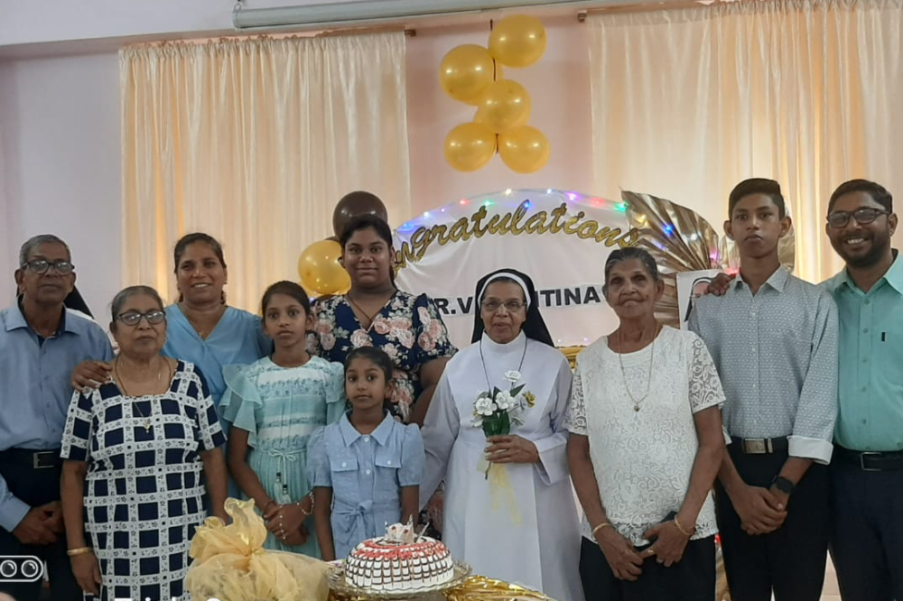 Sr. Valentine Cota celebrates with family members during the reception following her Golden Jubilee celebration. (Courtesy of Molly Fernades)