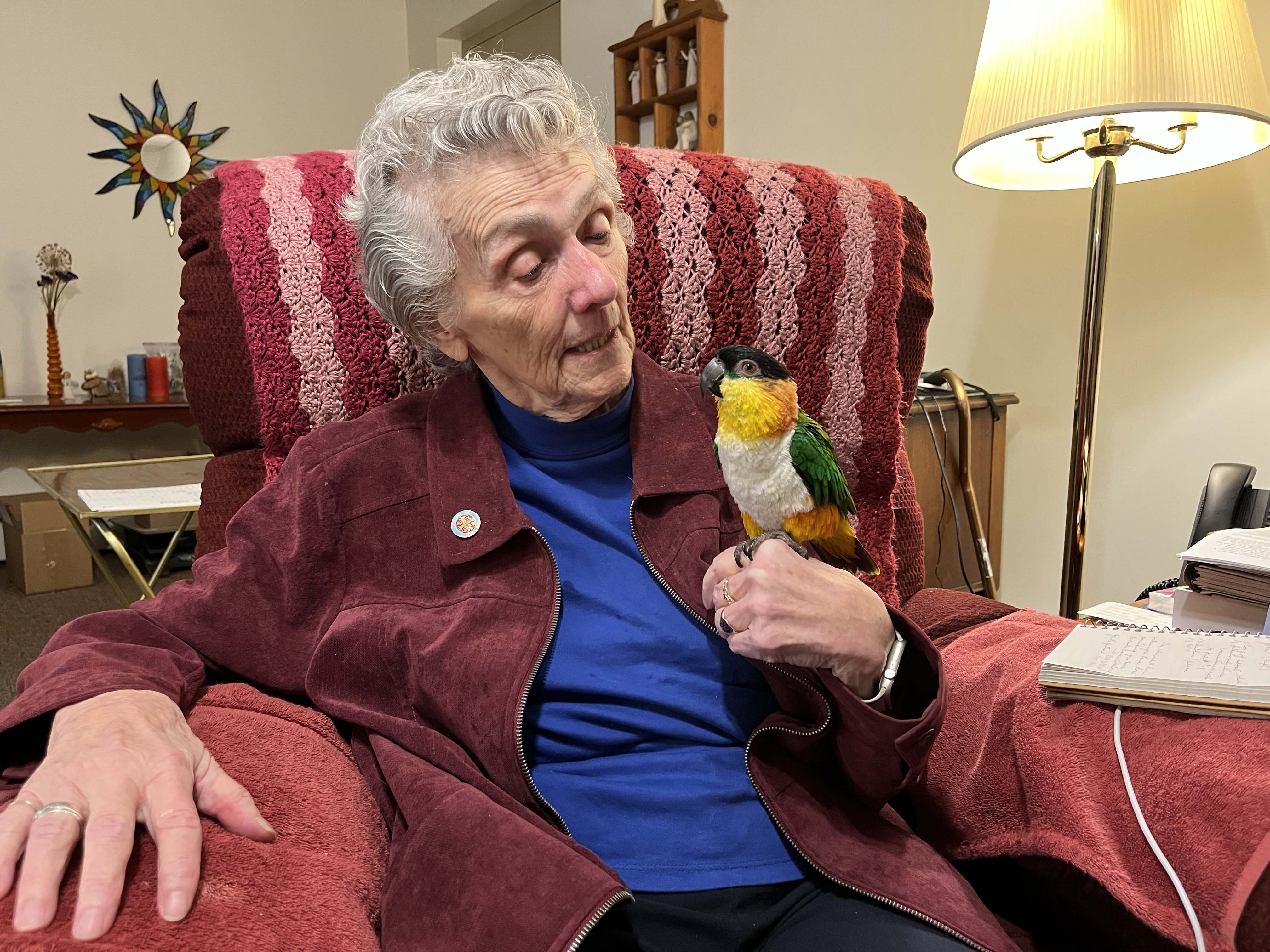 Joan Chittister is pictured with her bird Lady Hildegard. (Courtesy of Joan Chittister/Anne McCarthy)