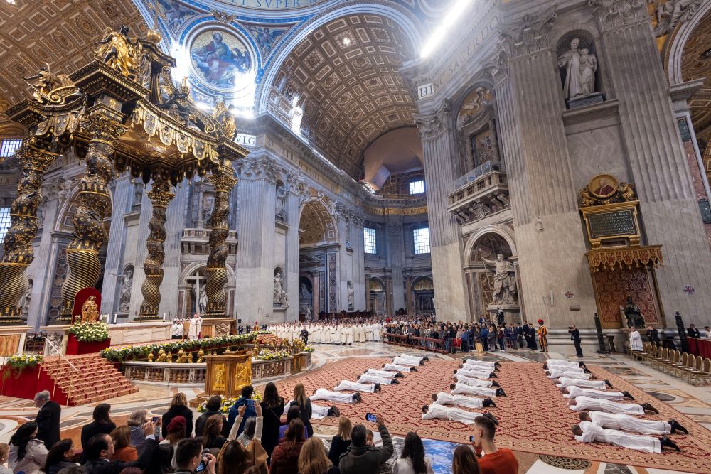 Deacons lie prostrate during ordination Mass in St. Peter's Basilica during the Jubilee of Deacons at the Vatican Feb. 23.