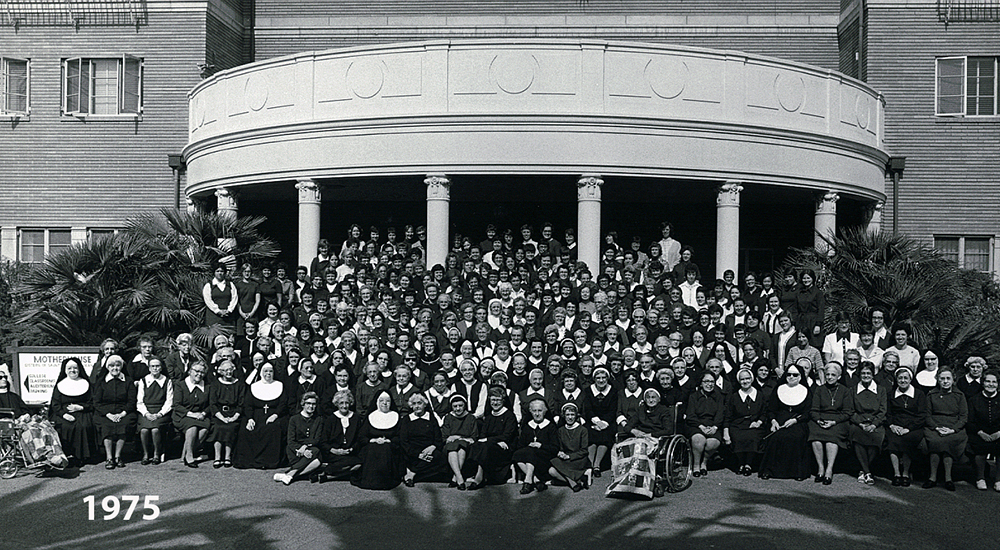 Sisters of St. Joseph of Orange pose for a group portrait in front of the order's motherhouse in Orange, California, in 1975. The motherhouse was built in 1959 to house 60 sisters; in June 2025, the newly renovated building opened as Villa St. Joseph, a senior housing complex run by Mercy Housing. (Courtesy of the Sisters of St. Joseph of Orange)