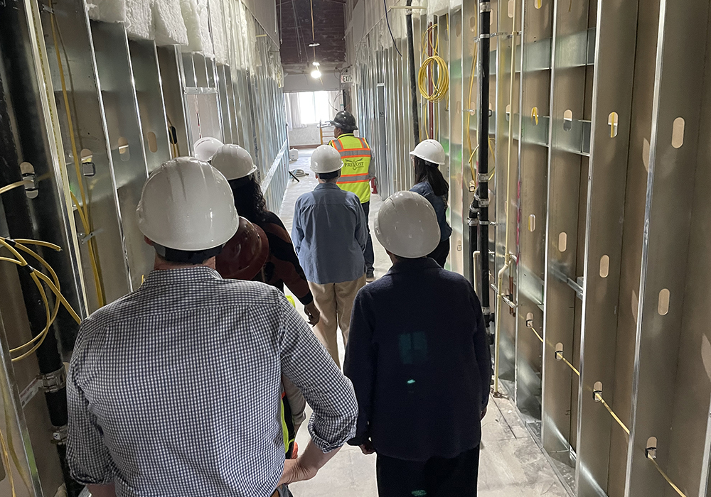 Officials tour the renovations taking place in May 2023 to convert the Sisters of St. Joseph of Orange motherhouse in Orange, California, into senior housing. (Courtesy of the Sisters of St. Joseph of Orange)