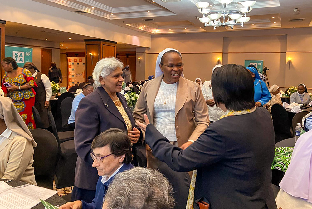 Little Sister of St. Francis Sr. Jane Wakahiu, center, associate vice president of program operations at the Hilton Foundation, interacts with participants during the Talitha Kum Africa Second Regional Assembly that was held in Zambia Nov. 17-21, 2025. (Courtesy of UISG)
