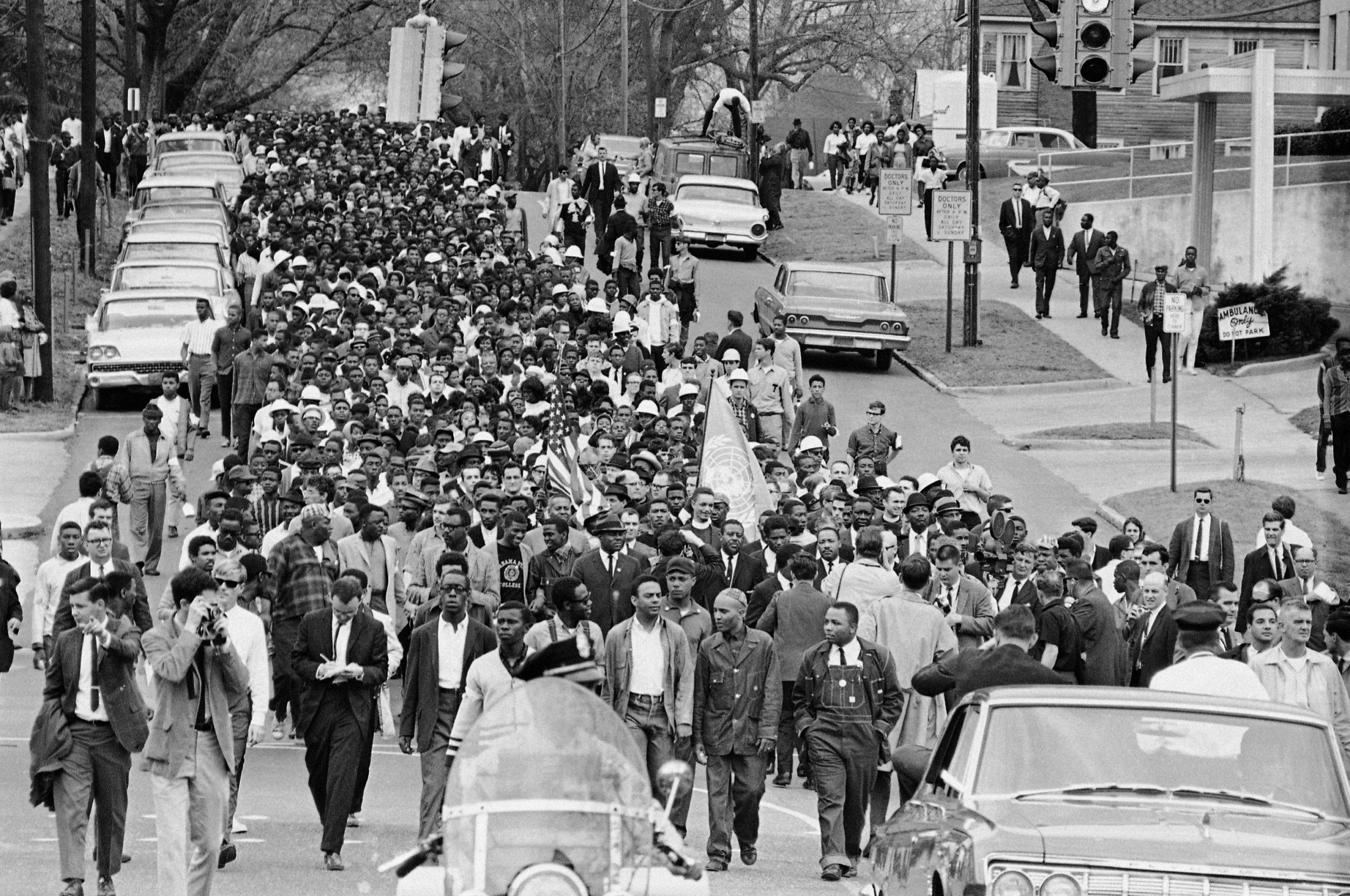 FILE – In this March 17, 1965, file photo, demonstrators walk to the courthouse behind the Rev. Martin Luther King Jr. in Montgomery, Ala. The march was to protest treatment of demonstrators by police during an attempted march. (AP Photo/File) FILE – In this March 17, 1965, file photo, demonstrators walk to the courthouse behind the Rev. Martin Luther King Jr. in Montgomery, Ala. The march was to protest treatment of demonstrators by police during an attempted march. (AP Photo/File)