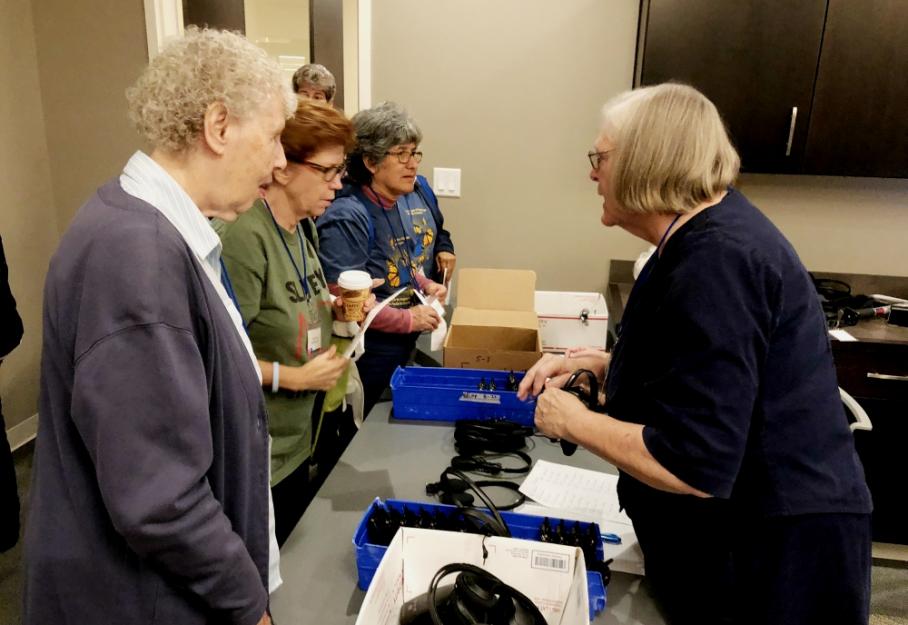 With four languages spoken by those in the room, sisters used interpreters and headsets for all the presentations.