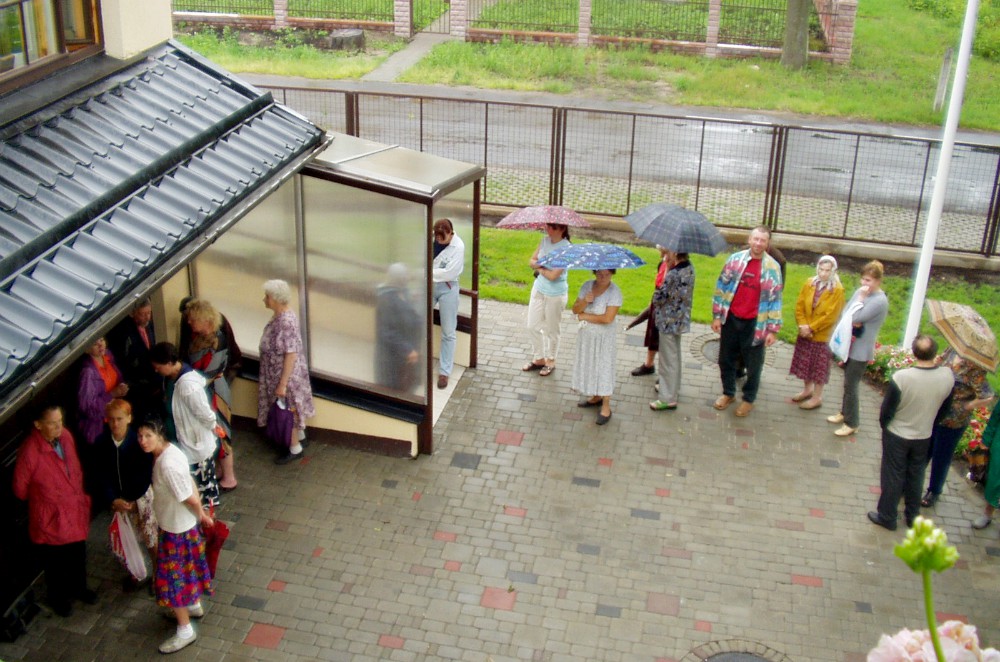 People wait for food outside the convent of the Dominican Sisters of Bethany in Riga, Latvia. (Marjolein Bruinen)