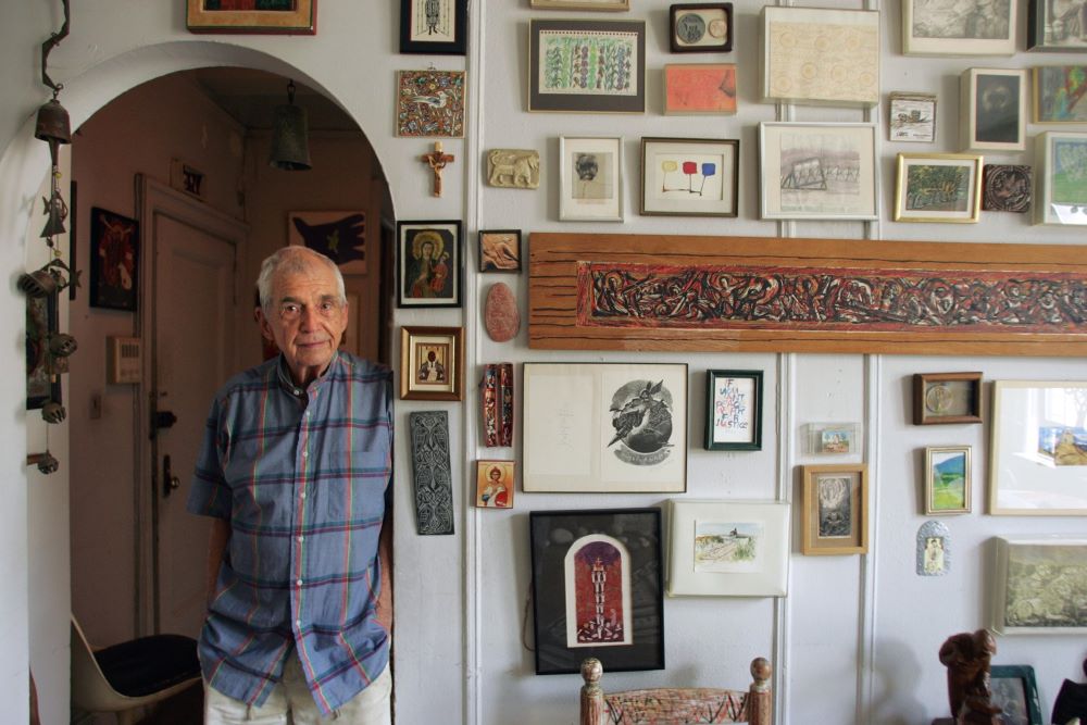 Jesuit Fr. Daniel Berrigan, then 85, poses in his New York City apartment in 2006. Berrigan died in 2016 at age 94. (CNS/Todd Plitt)