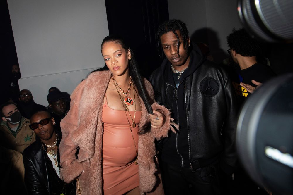 Rihanna, left, and ASAP Rocky arrive for the Off-White Ready To Wear Fall/Winter 2022-2023 fashion collection, unveiled during Fashion Week in Paris Feb. 28. Rihanna's pregnancy became public Jan. 31 with a photo of her baring her baby bump. (AP/Invision/