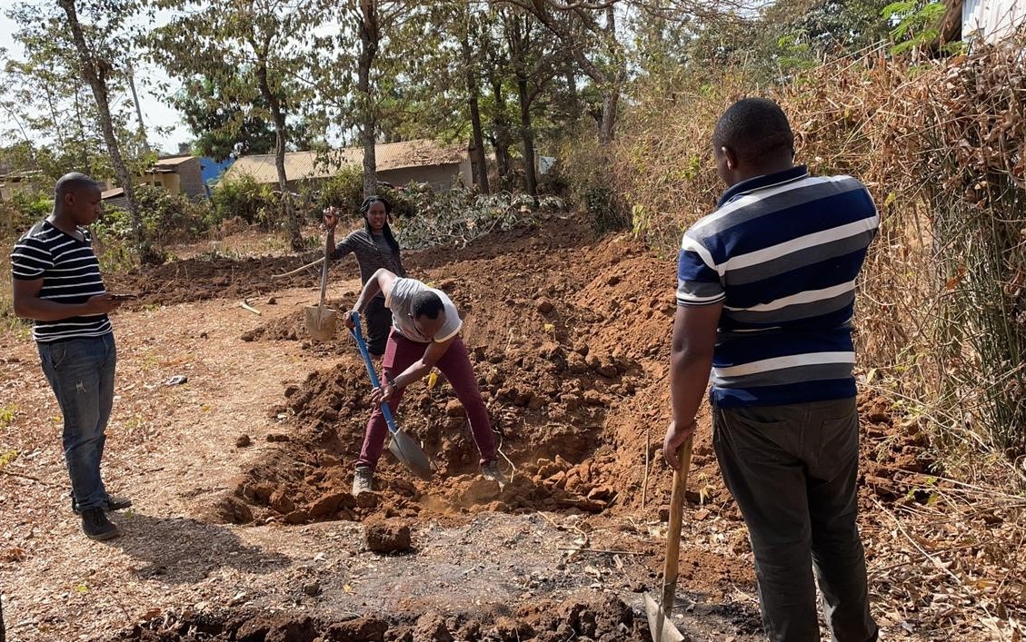 Youth with the Catholic Youth Network for Environmental Sustainability Africa work at a demonstration site in central Kenya. (Courtesy of CYNESA/Allen Ottaro)