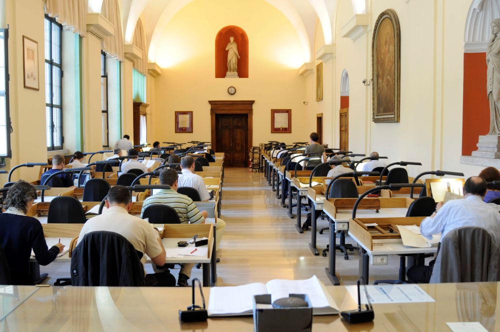 Scholars review materials in the Vatican Secret Archives in this undated photo. After decades of anticipation, the Vatican in March 2020 opened its archives on the World War II pontificate of Pope Pius XII. (CNS/Courtesy Vatican Secret Archives)