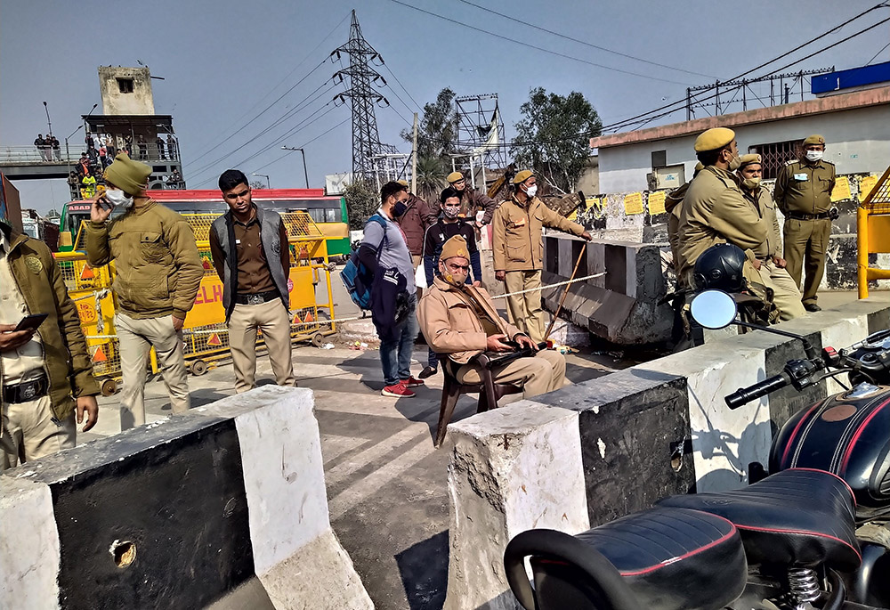 Police barricades prevent people from joining farmers protesting on the borders of the Indian capital. (Jessy Joseph)