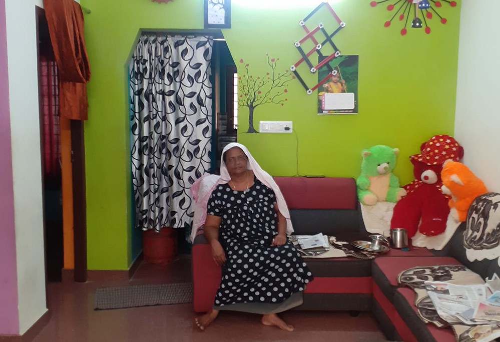 A widow now lives in a new house that her daughter helped build at Udaya Colony in Kochi, India. (Rita Joseph)