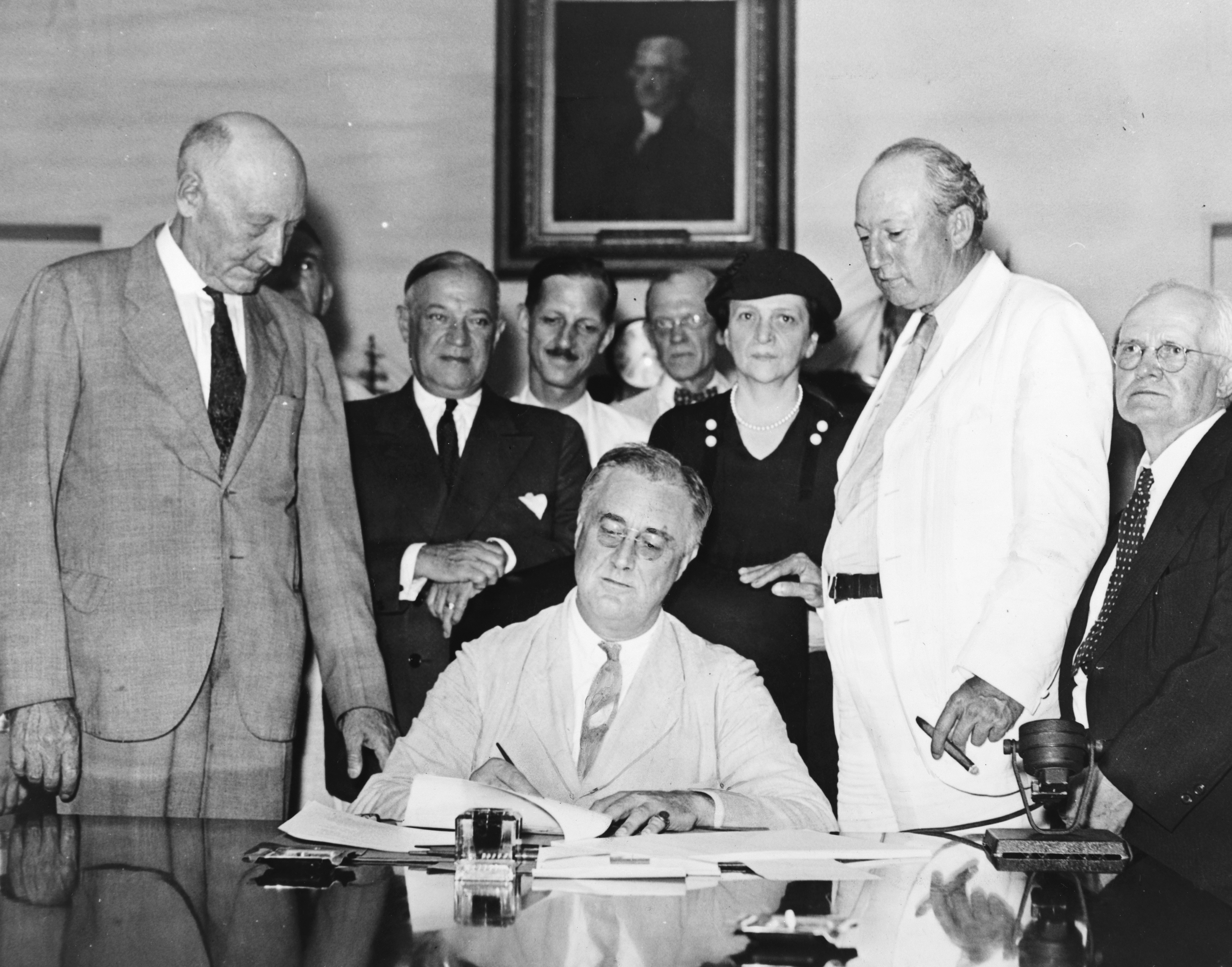 President Franklin D. Roosevelt signs the Social Security Act Aug. 14, 1935. It was one several programs Roosevelt enacted from 1933 to 1939 as part of the New Deal, intended to stabilize the country's economy and provide relief to American workers and fa