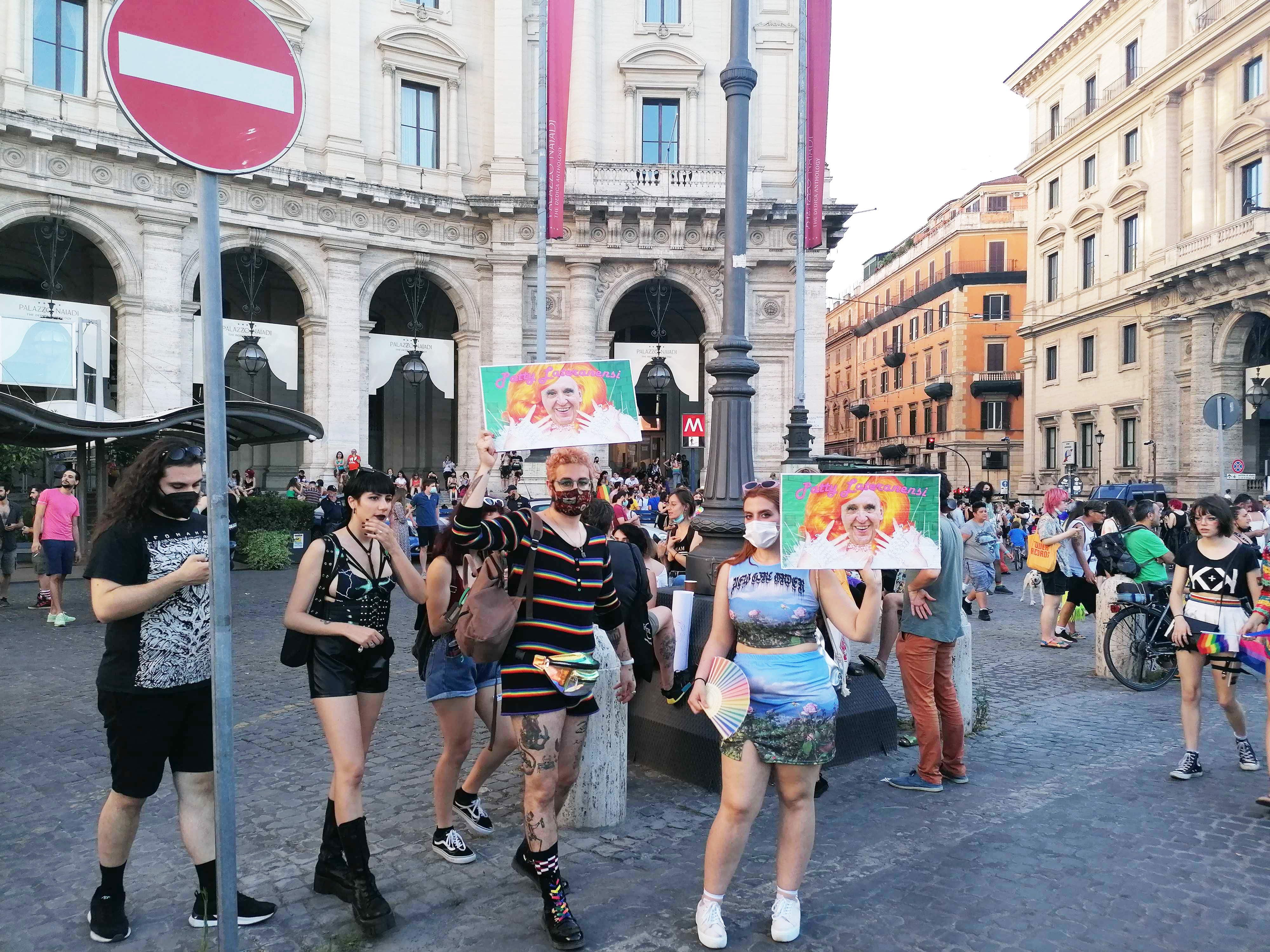 People gather with signs and bright clothing for the pride parade in Rome held last month. RNS photo by Claire Giangravè