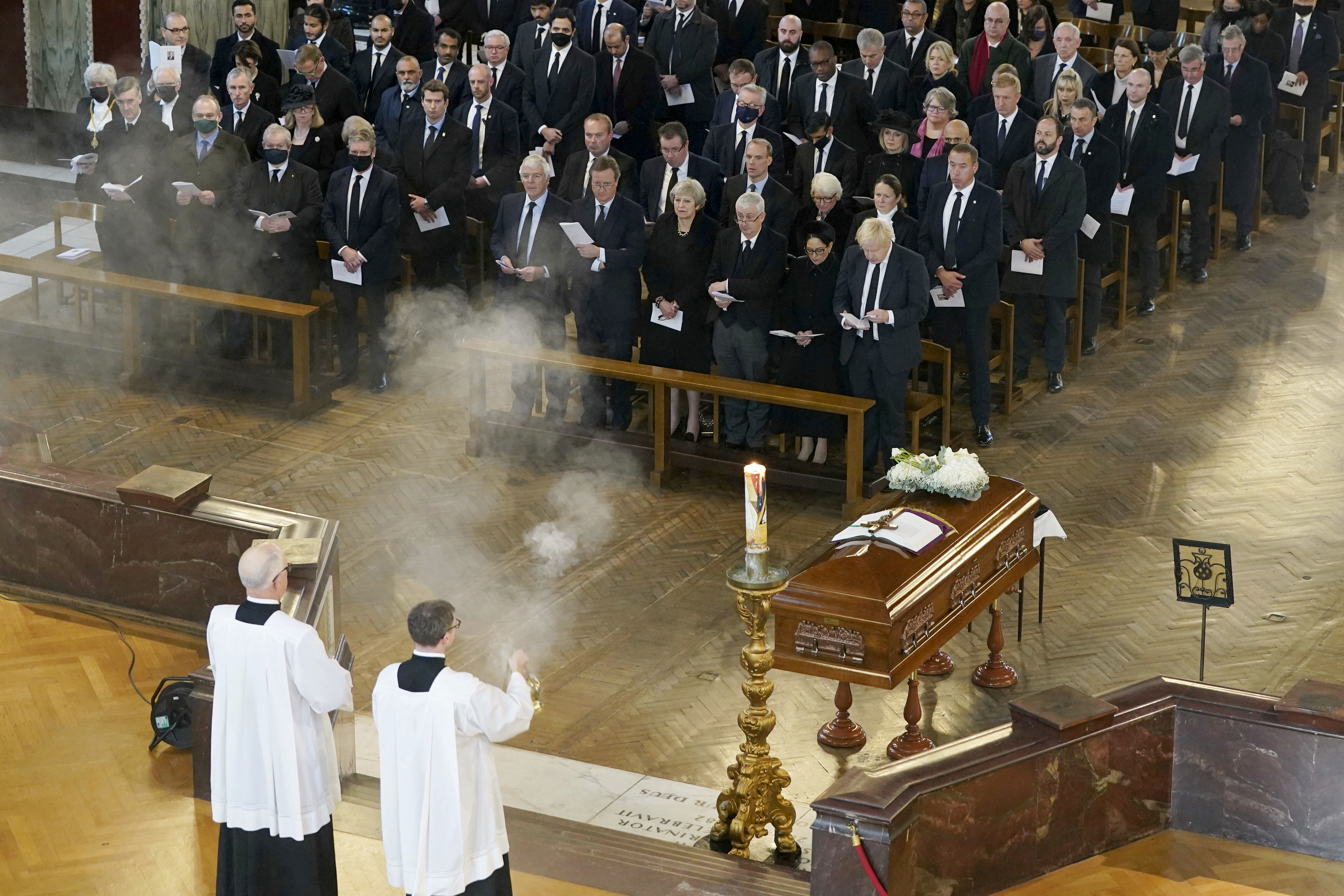 British Prime Minister Boris Johnson, right in front row, attends a Requiem Mass for slain member of parliament David Amess, inside Westminster Cathedral, central London, Tuesday, Nov. 23, 2021. (Stefan Rousseau/Pool Photo via AP) British Prime Minister Boris Johnson, right in front row, attends a Requiem Mass for slain member of parliament David Amess, inside Westminster Cathedral, central London, Tuesday, Nov. 23, 2021. (Stefan Rousseau/Pool Photo via AP)