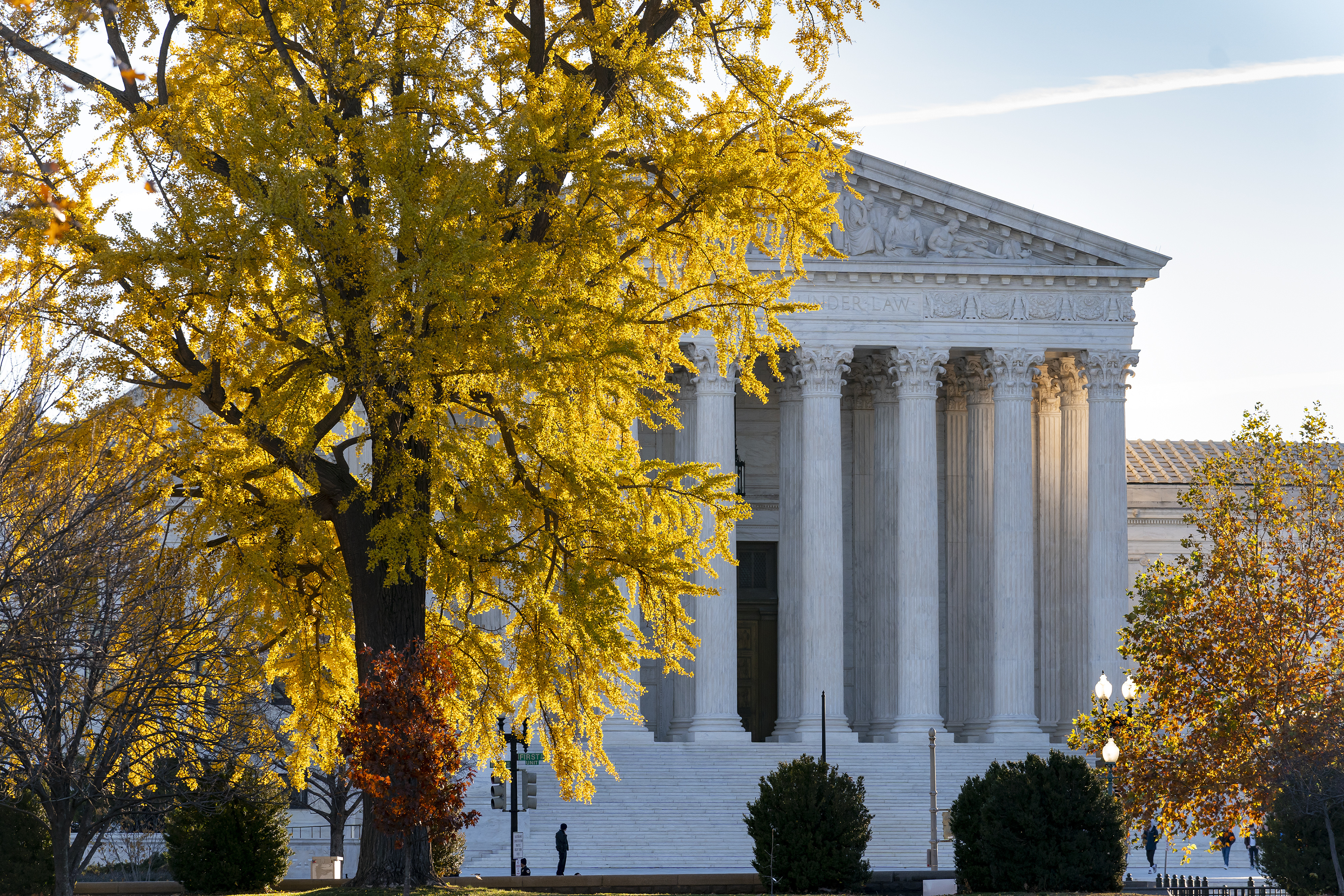 Light from the morning sun illuminates the Supreme Court in Washington, Friday, Dec. 3, 2021. (AP Photo/J. Scott Applewhite)