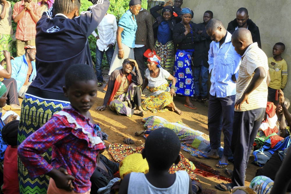 On Oct. 5, family members and onlookers mourn over bodies of civilians killed by the Allied Democratic Forces rebels in Beni, Democratic Republic of Congo. (AP Photo/Al-hadji Kudra Maliro) On Oct. 5, family members and onlookers mourn over bodies of civilians killed by the Allied Democratic Forces rebels in Beni, Democratic Republic of Congo. (AP Photo/Al-hadji Kudra Maliro)