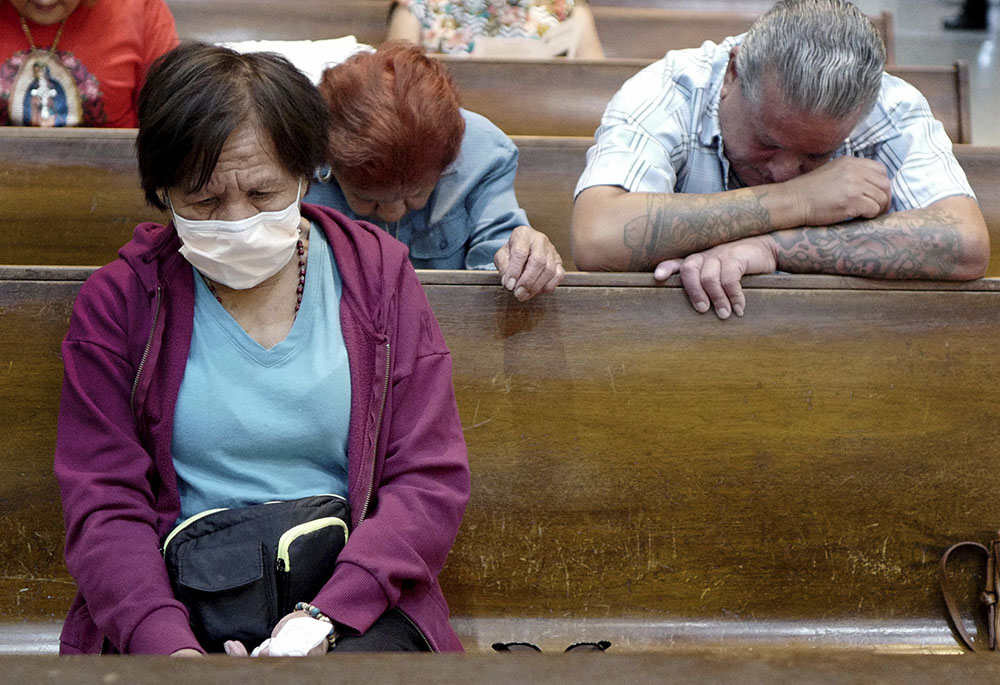 Esperanza Treviño, mother of Melissa Lucio, bows her head during a vigil at the Basilica of Our Lady of San Juan del Valle National Shrine April 22 in San Juan, Texas. On April 25, the Texas Court of Criminal Appeals stayed Lucio's execution.