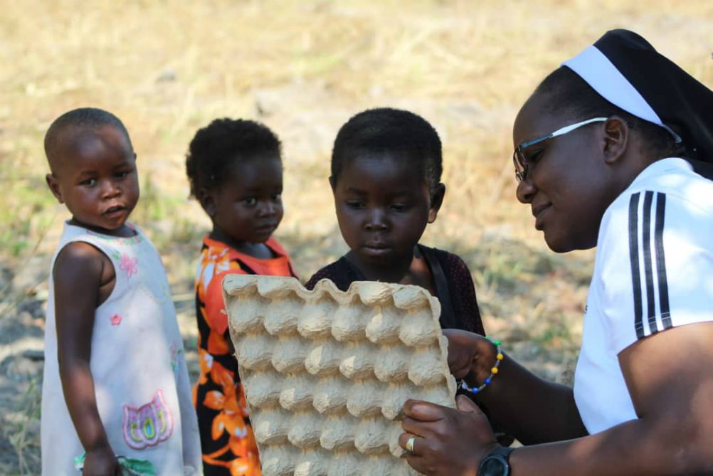 Sr. Astridah Banda, who is also a social worker, provides literary classes to children in rural Zambia who have not started formal school to encourage an interest in learning. (Provided photo)