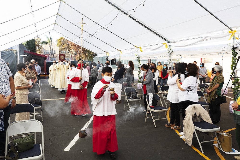 Fr. Juan Ochoa, administrator of Christ the King Church near Hancock Park, California, processes during the opening Mass Nov. 22, 2020. (CNS/Angelus News/Victor Aleman)