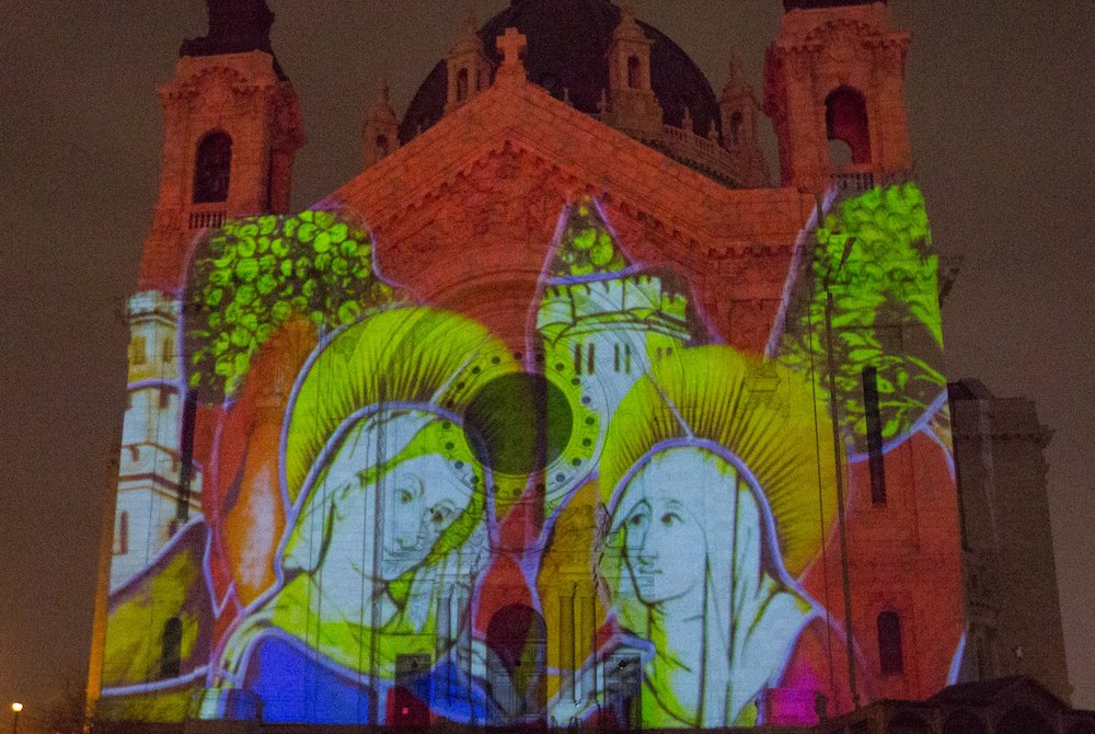 An image telling part of the Nativity story is reflected on the Cathedral of St. Paul in St. Paul, Minnesota, Dec. 17. (CNS/ The Catholic Spirit/Dave Hrbacek)