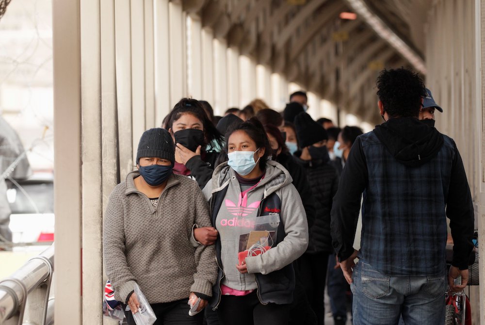 People who were deported from the U.S. walk across Paso del Norte International Border bridge in Ciudad Juarez, Mexico, Feb. 25, 2021. (CNS/Reuters/Jose Luis Gonzalez) People who were deported from the U.S. walk across Paso del Norte International Border bridge in Ciudad Juarez, Mexico, Feb. 25, 2021. (CNS/Reuters/Jose Luis Gonzalez)