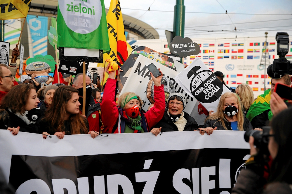 Protesters march outside the venue of the U.N. climate change conference, or COP24, Dec. 8, 2018, in Katowice, Poland. (CNS/Reuters/Kacper Pempel)