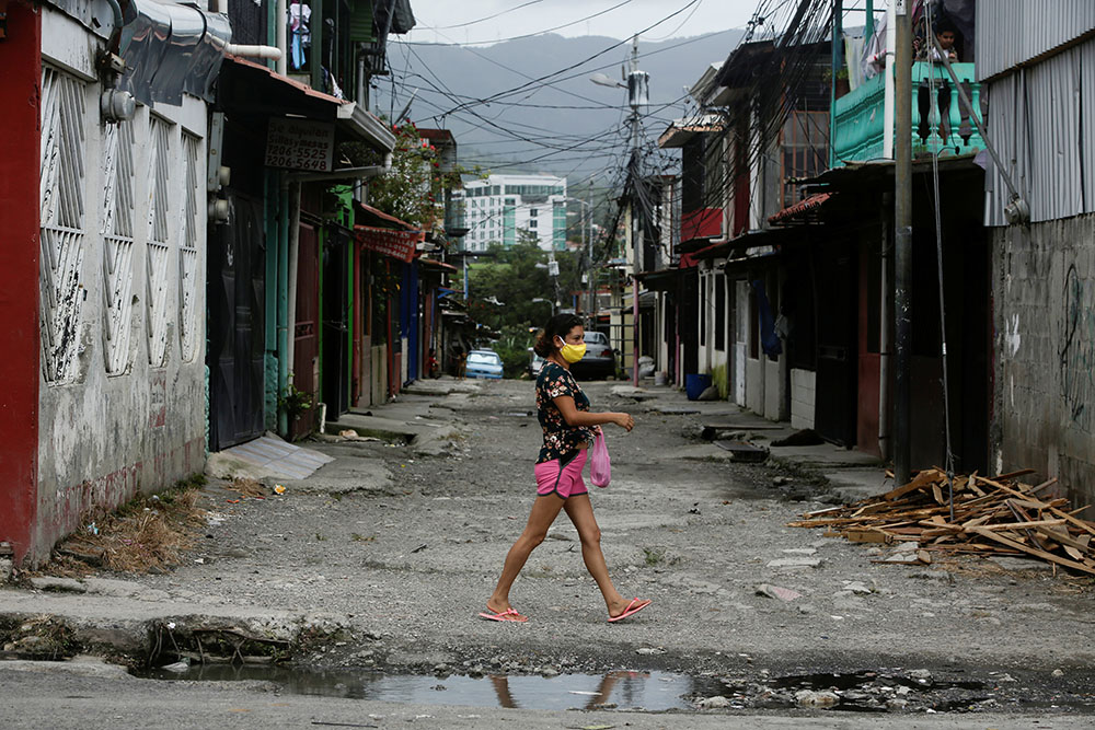 A woman wearing a face mask walks after taking a test for the coronavirus in San José, Costa Rica, June 26. (CNS/Reuters/Juan Carlos Ulate)