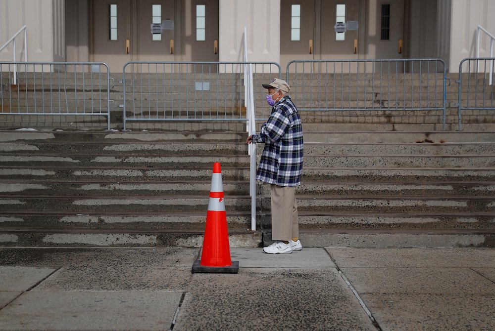 An elderly man in White Plains, New York, waits in line to receive a COVID-19 vaccine Feb. 23, 2021. (CNS/Reuters/Mike Segar)