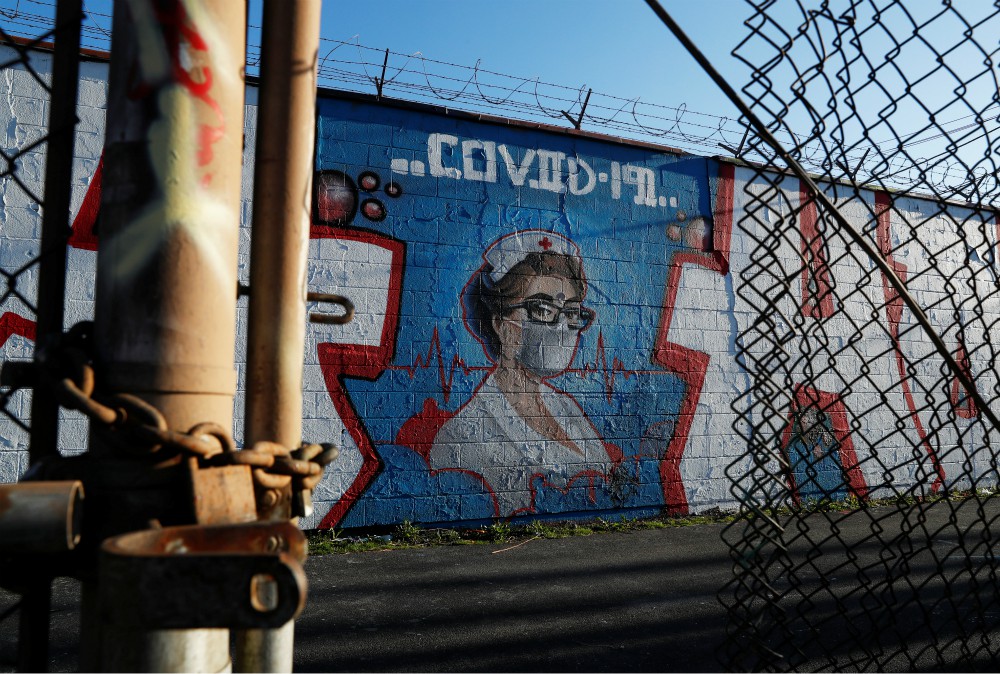 A mural of a health care worker is seen in Chicago April 21 during the coronavirus pandemic. "My conversations with local officials is simply this: Tell us what you need, and we'll see what we can do," says Chicago Cardinal Blase Cupich. (CNS/Reuters)