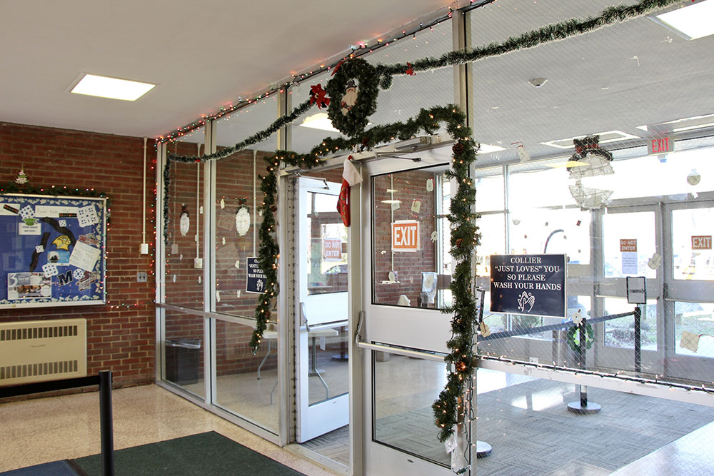 Collier High School's lobby is decorated to celebrate the holidays. Staff members go out of their way to celebrate the students' different traditions, and a festive lobby is one way they make this happen. (Maddie Thompson)