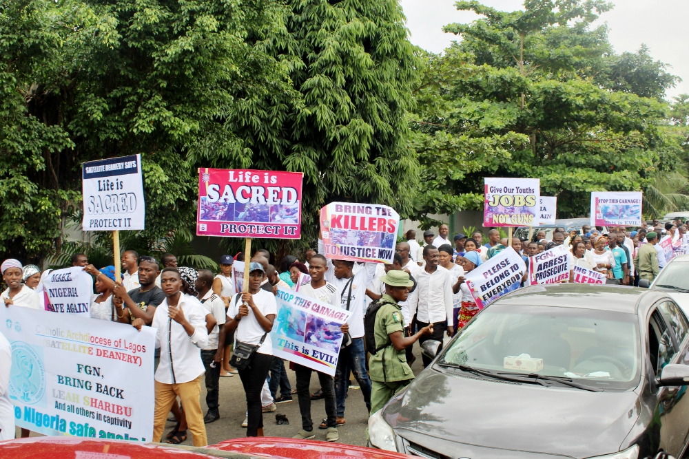 Crowds of people hoist placards, sing hymns and pray the rosary in Lagos May 22 during a peaceful and prayerful protest against recent killings in Nigeria. (Festus Iyorah) Crowds of people hoist placards, sing hymns and pray the rosary in Lagos May 22 during a peaceful and prayerful protest against recent killings in Nigeria. (Festus Iyorah)